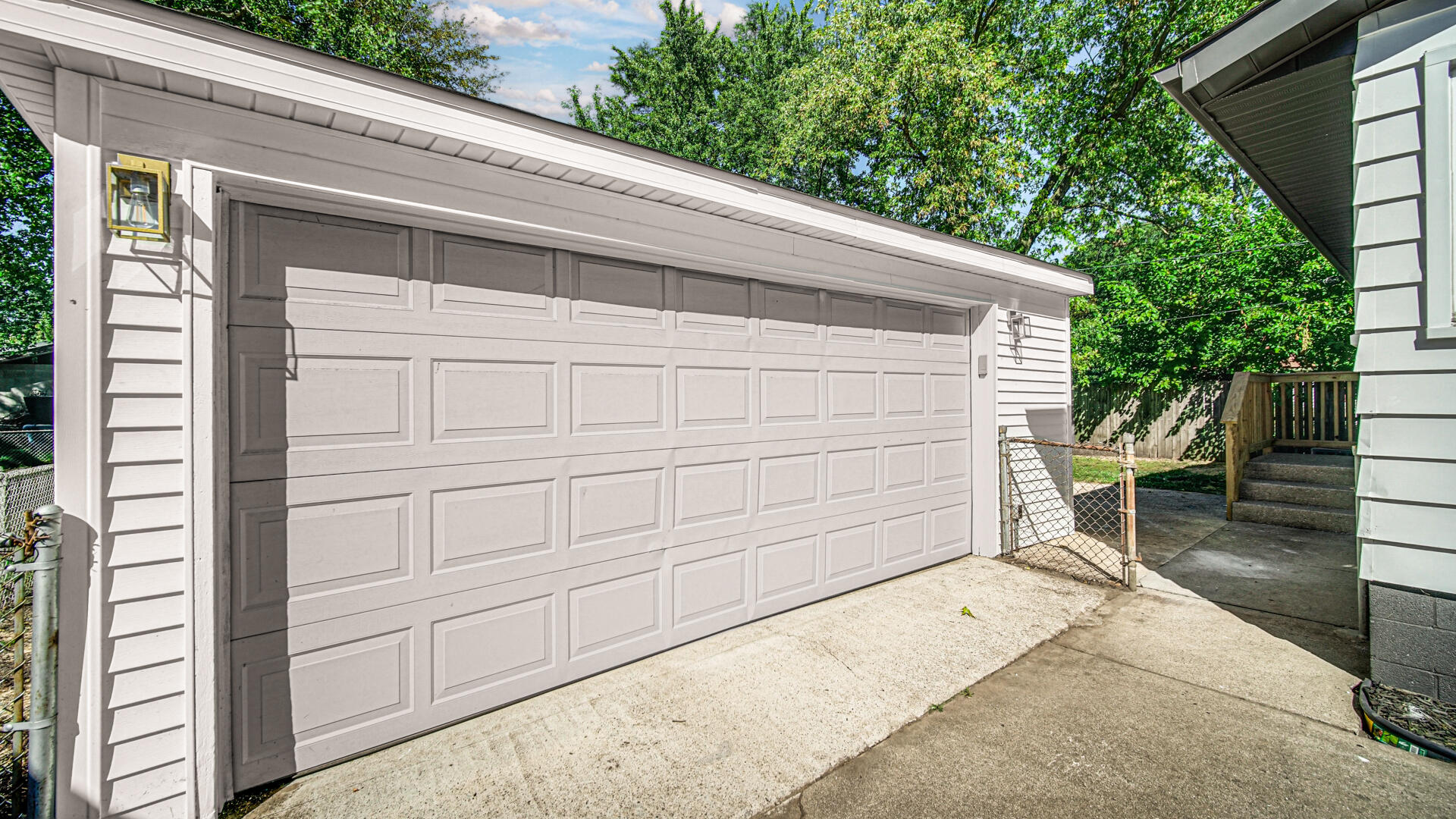 4440 East 13th Place Gary, IN 46403 - Photo 21 of 25 a backyard of a house with wooden fence and trees