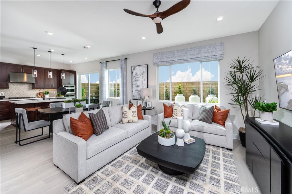 224 Lily Loop Irvine, CA 92618 - Photo 5 of 13 a living room with furniture and a large window