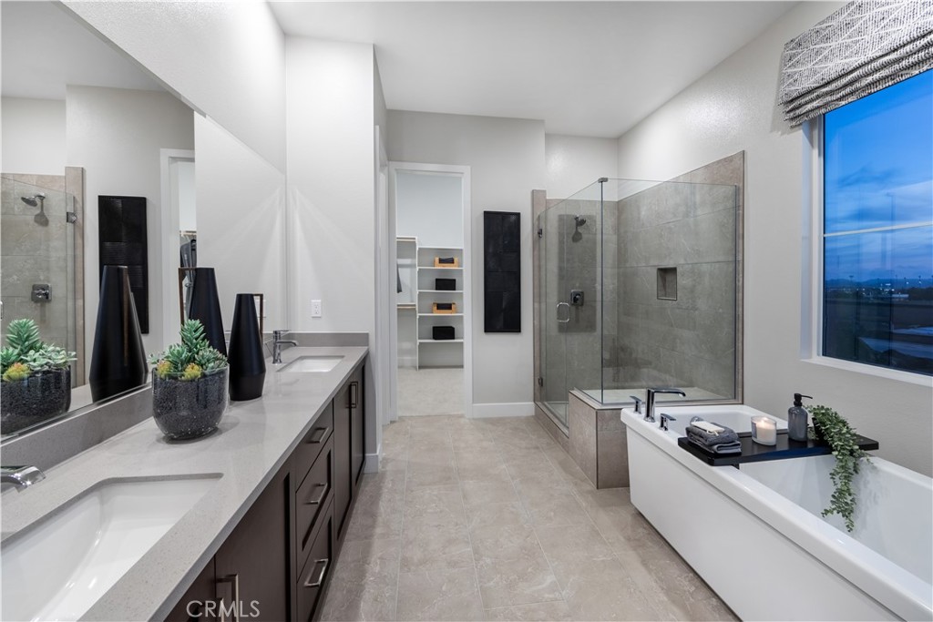 224 Lily Loop Irvine, CA 92618 - Photo 7 of 13 a large white kitchen with a large window and stainless steel appliances