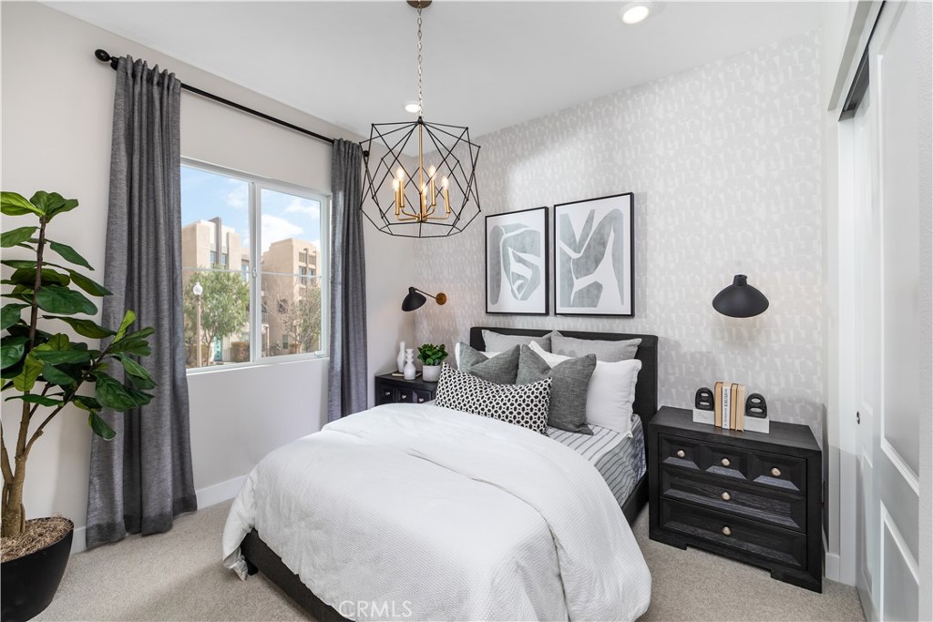 224 Lily Loop Irvine, CA 92618 - Photo 9 of 13 a bedroom with a bed and a potted plant