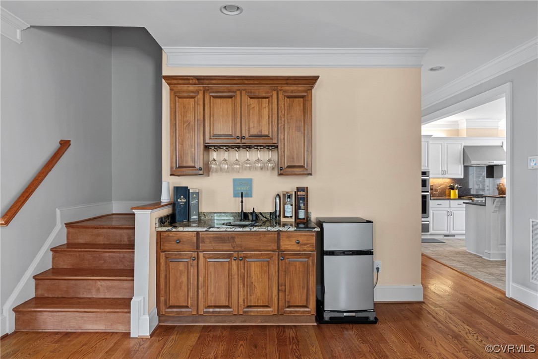 14424 Riverside Drive Ashland, VA 23005 - Photo 11 of 40 Bar featuring wet bar, stainless steel appliances,