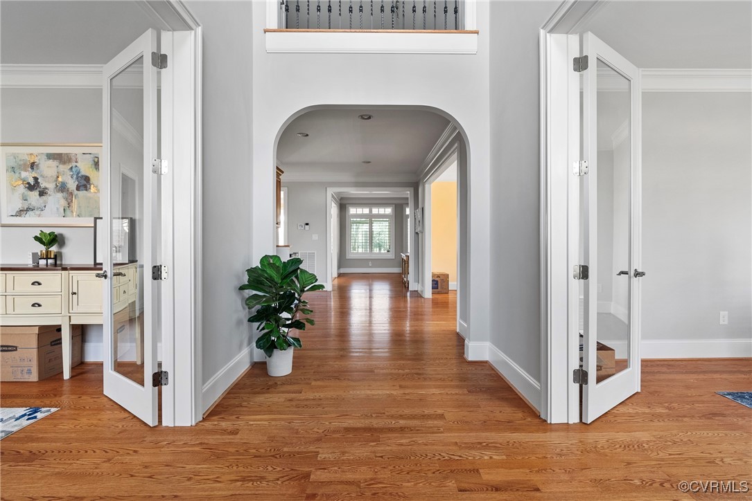 14424 Riverside Drive Ashland, VA 23005 - Photo 15 of 40 Corridor with arched walkways, crown molding, base