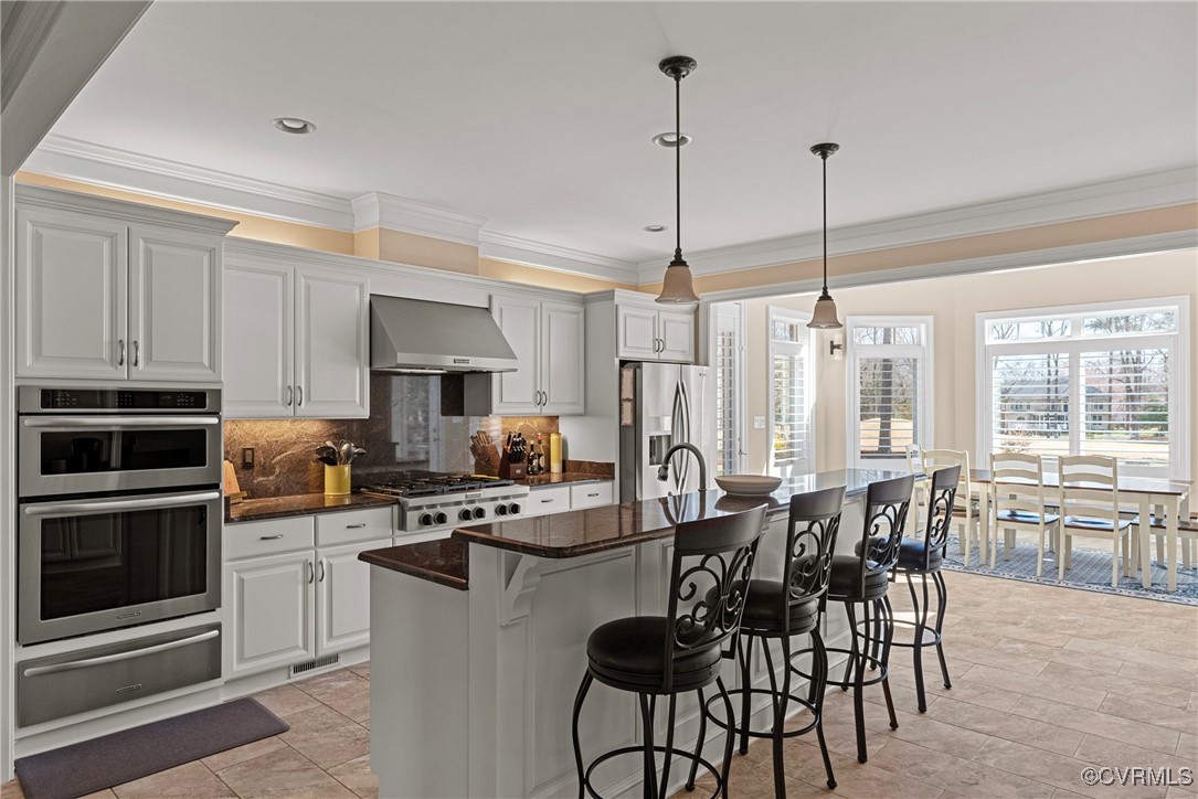 14424 Riverside Drive Ashland, VA 23005 - Photo 3 of 40 Kitchen with backsplash, wall chimney range hood,