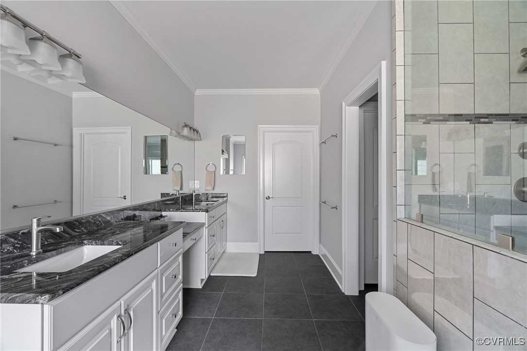 14424 Riverside Drive Ashland, VA 23005 - Photo 31 of 40 Bathroom featuring a sink, a stall shower, crown m