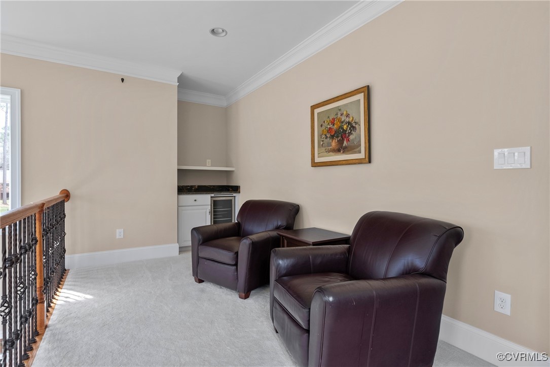 14424 Riverside Drive Ashland, VA 23005 - Photo 34 of 40 Living area with crown molding, baseboards, wine c