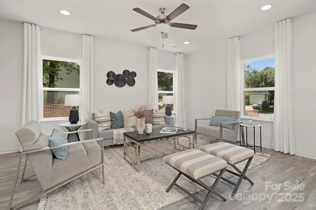 a living room with furniture and a large window