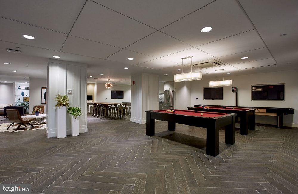 1616 Walnut Street, Unit 1B1404 Philadelphia, PA 19103 - Photo 19 of 28 a lobby with furniture and a rug