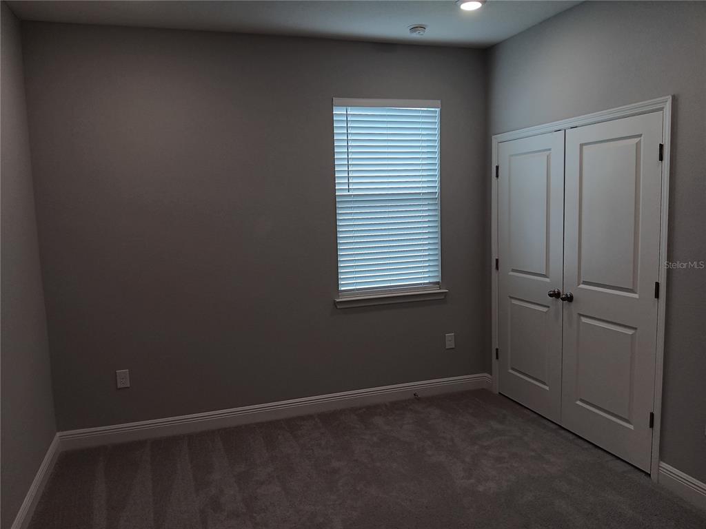 5433 Southwest 44th Ct Road Ocala, FL 34474 - Photo 16 of 24 an empty room with windows
