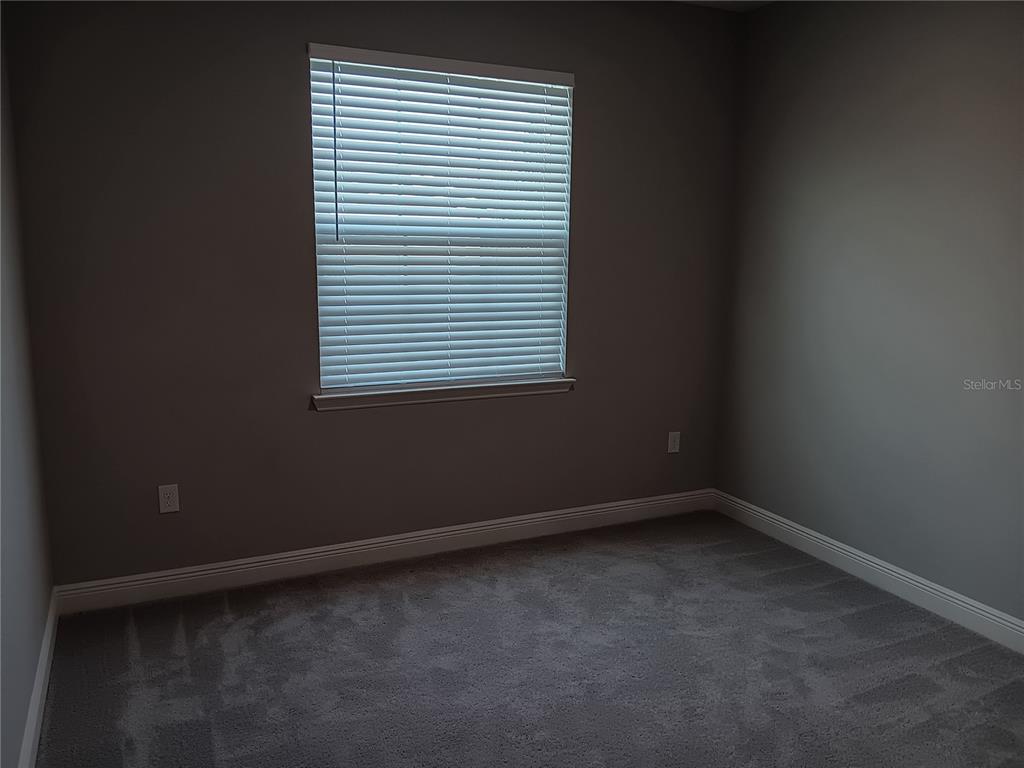 5433 Southwest 44th Ct Road Ocala, FL 34474 - Photo 20 of 24 an empty room with a window