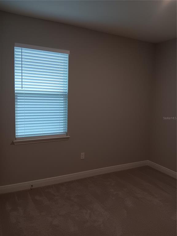 5433 Southwest 44th Ct Road Ocala, FL 34474 - Photo 22 of 24 an empty room with a window