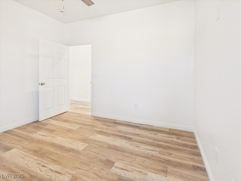 931 Lone Pine Road Pahrump, NV 89048 - Photo 11 of 48 Unfurnished room featuring light wood-style flooring and ceiling fan
