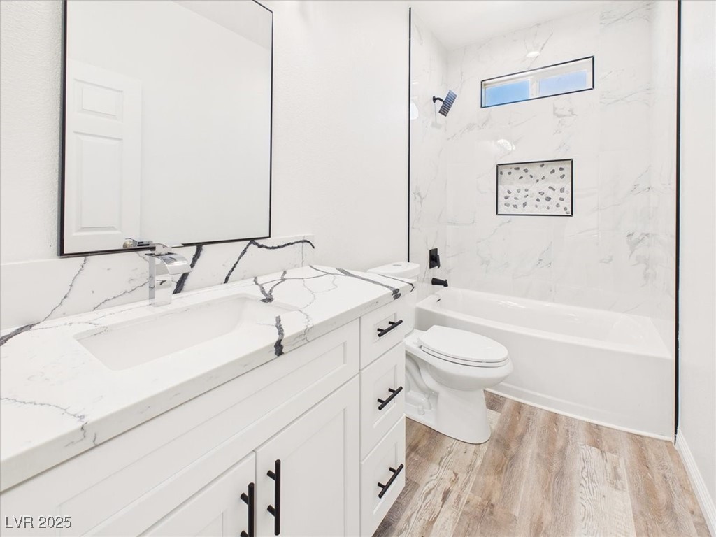 931 Lone Pine Road Pahrump, NV 89048 - Photo 14 of 48 Full bathroom featuring bathing tub / shower combination, vanity, and light wood finished floors