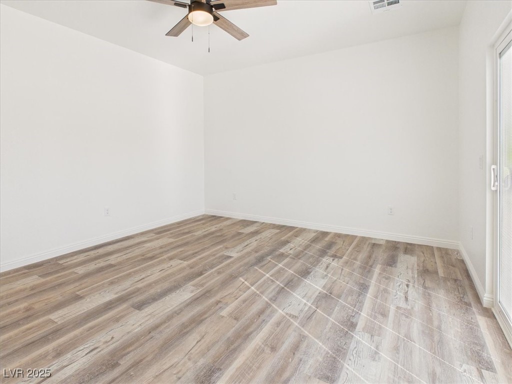 931 Lone Pine Road Pahrump, NV 89048 - Photo 16 of 48 Empty room featuring light wood-style flooring and ceiling fan