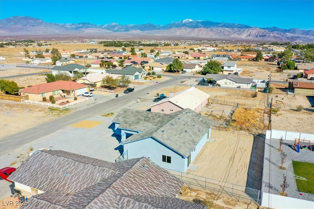 931 Lone Pine Road Pahrump, NV 89048 - Photo 41 of 48 Aerial perspective of suburban area with a mountainous background