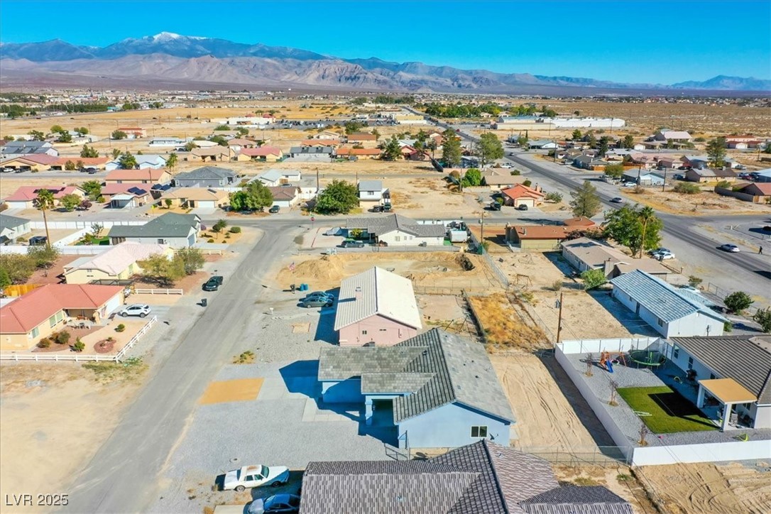 931 Lone Pine Road Pahrump, NV 89048 - Photo 43 of 48 Aerial view of residential area featuring a mountainous background