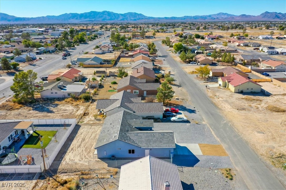 931 Lone Pine Road Pahrump, NV 89048 - Photo 45 of 48 Aerial perspective of suburban area featuring a mountainous background