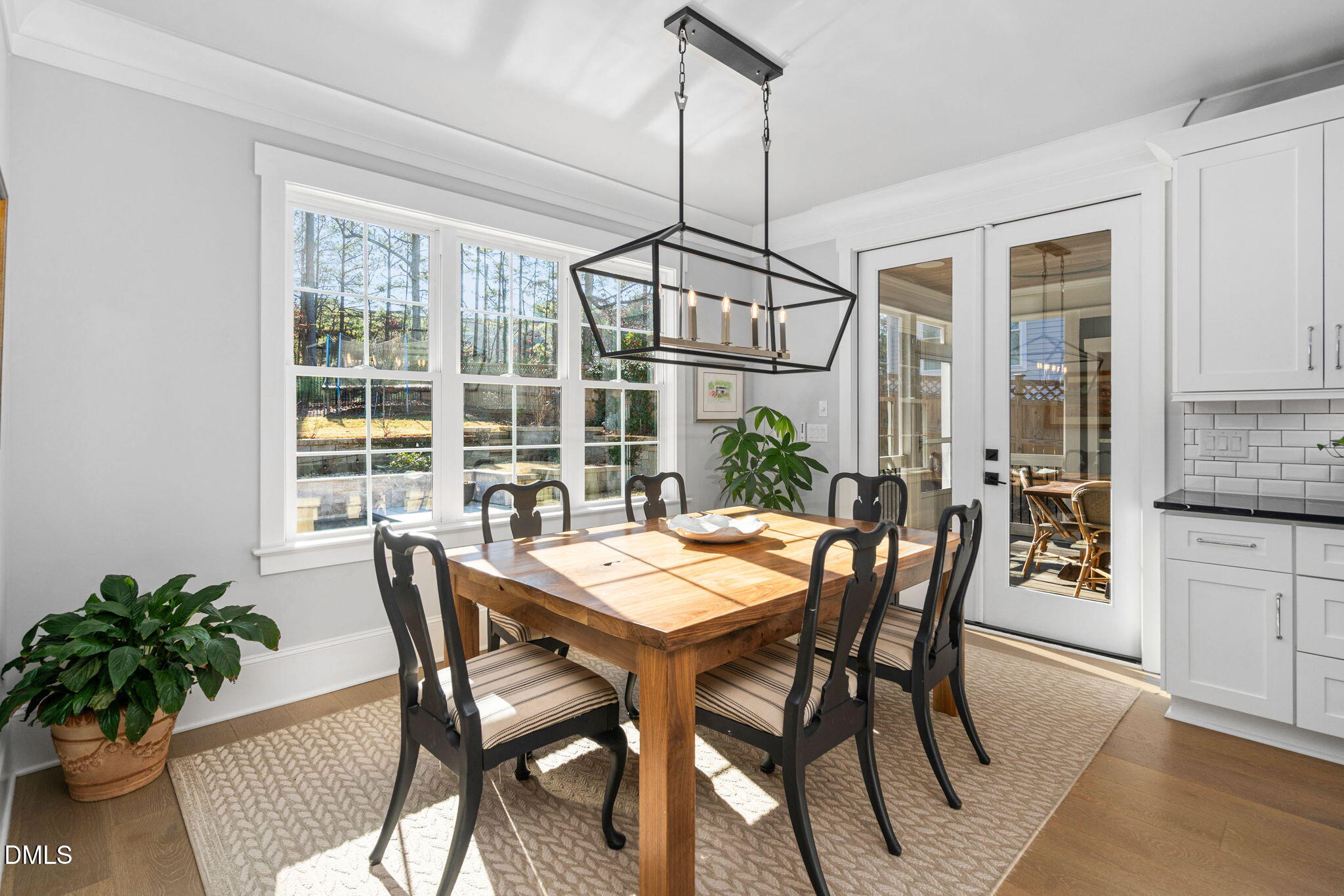 3417 Edgemont Drive Raleigh, NC 27612 - Photo 13 of 70 a view of a dining room with furniture window and wooden floor