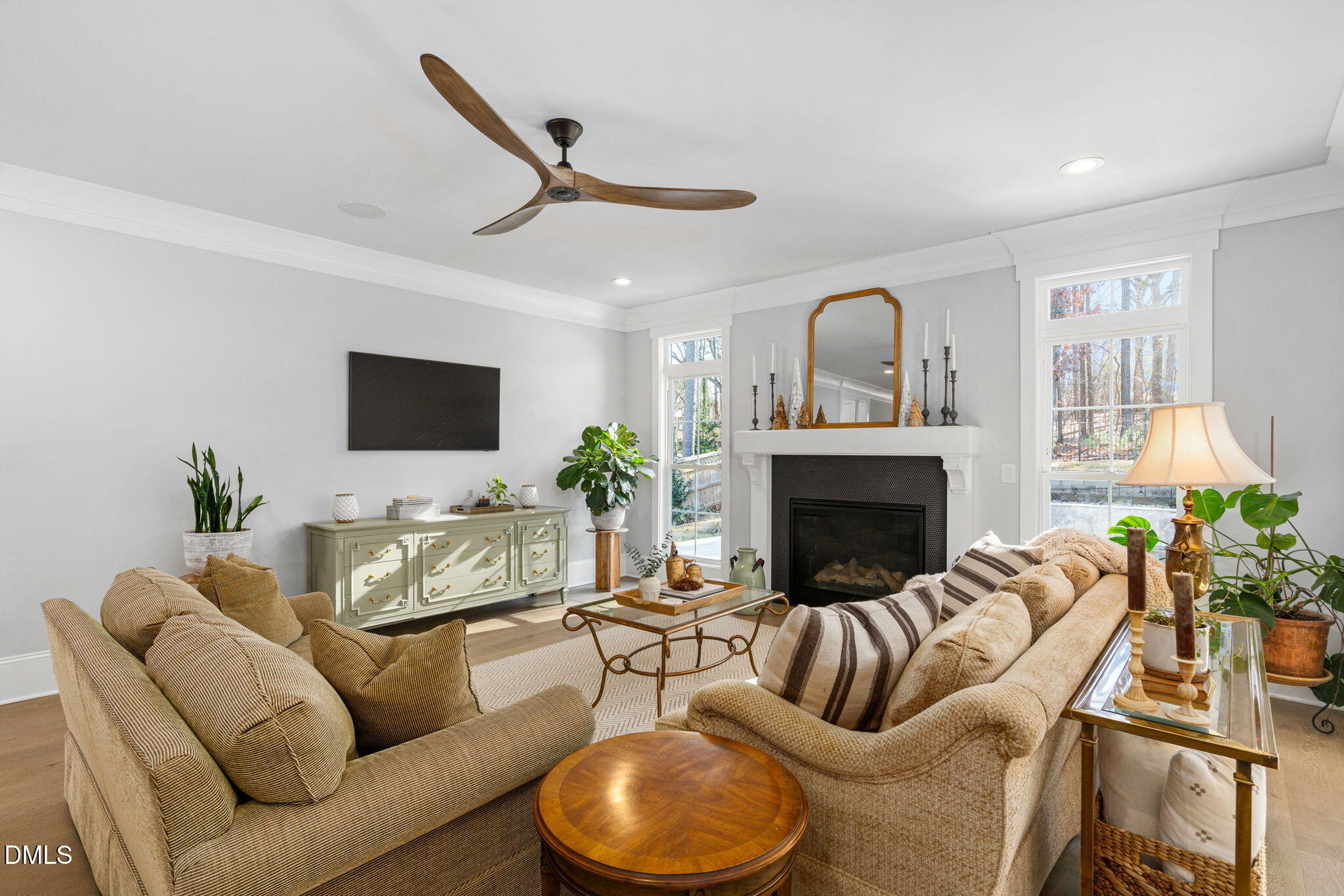 3417 Edgemont Drive Raleigh, NC 27612 - Photo 17 of 70 a living room with furniture fireplace and a flat screen tv