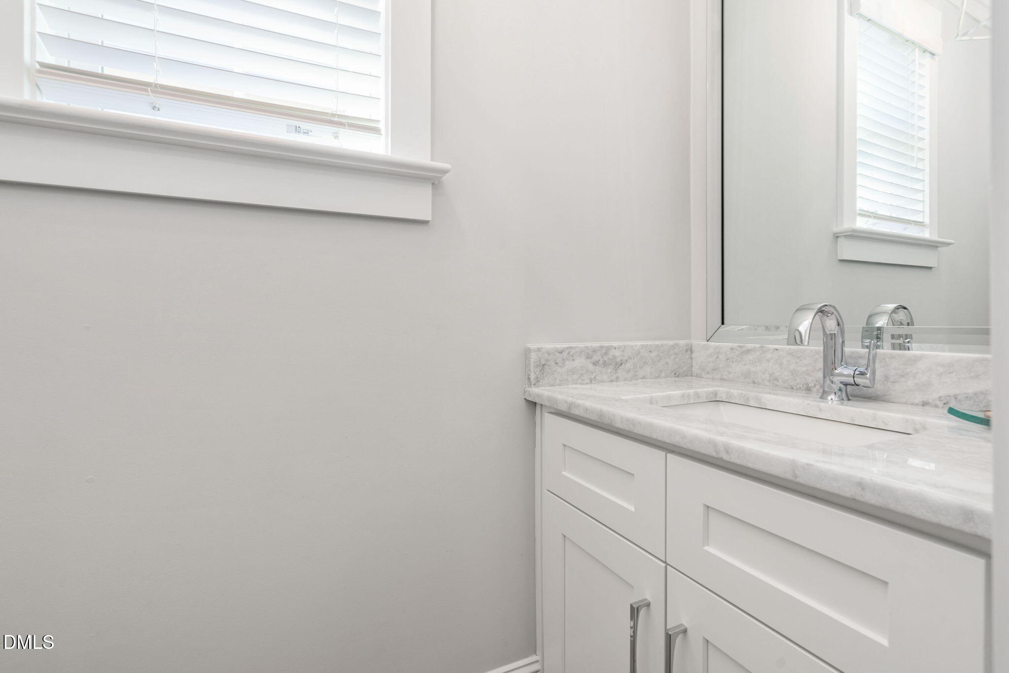 3417 Edgemont Drive Raleigh, NC 27612 - Photo 20 of 70 a bathroom with a granite countertop sink and a mirror