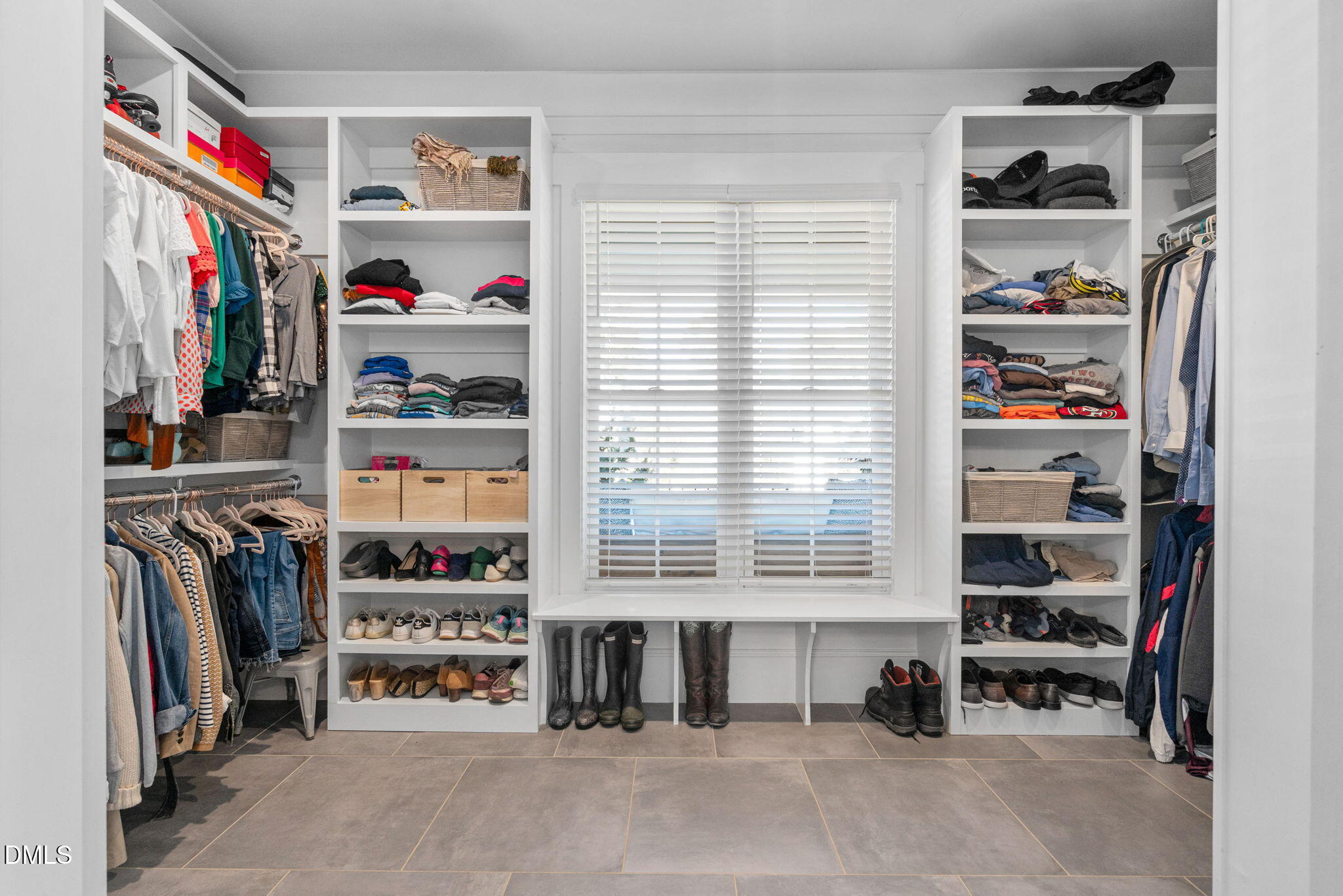 3417 Edgemont Drive Raleigh, NC 27612 - Photo 24 of 70 a view of walk in closet with clothes and shoes