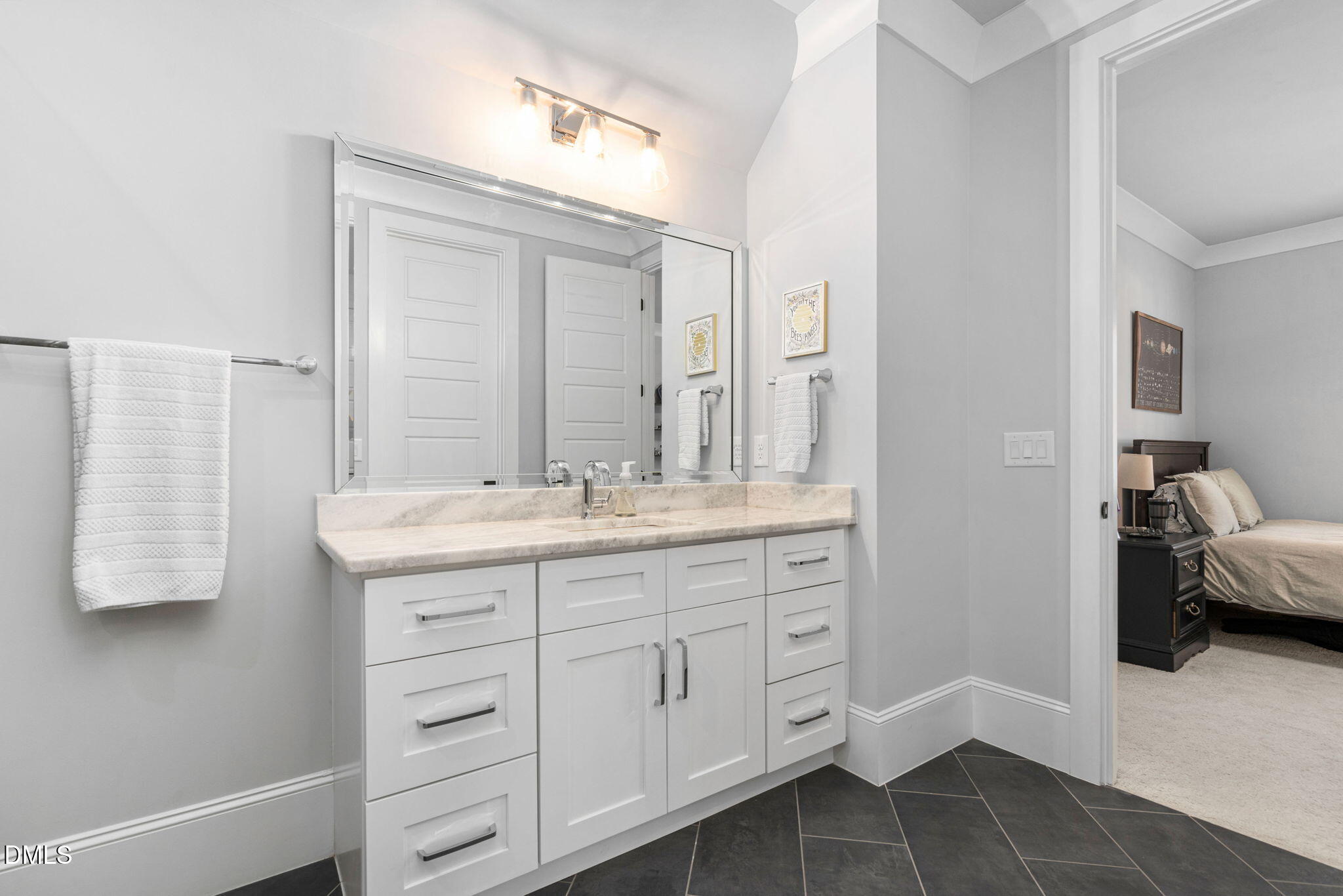 3417 Edgemont Drive Raleigh, NC 27612 - Photo 37 of 70 a en suite bathroom with a double vanity sink and a mirror