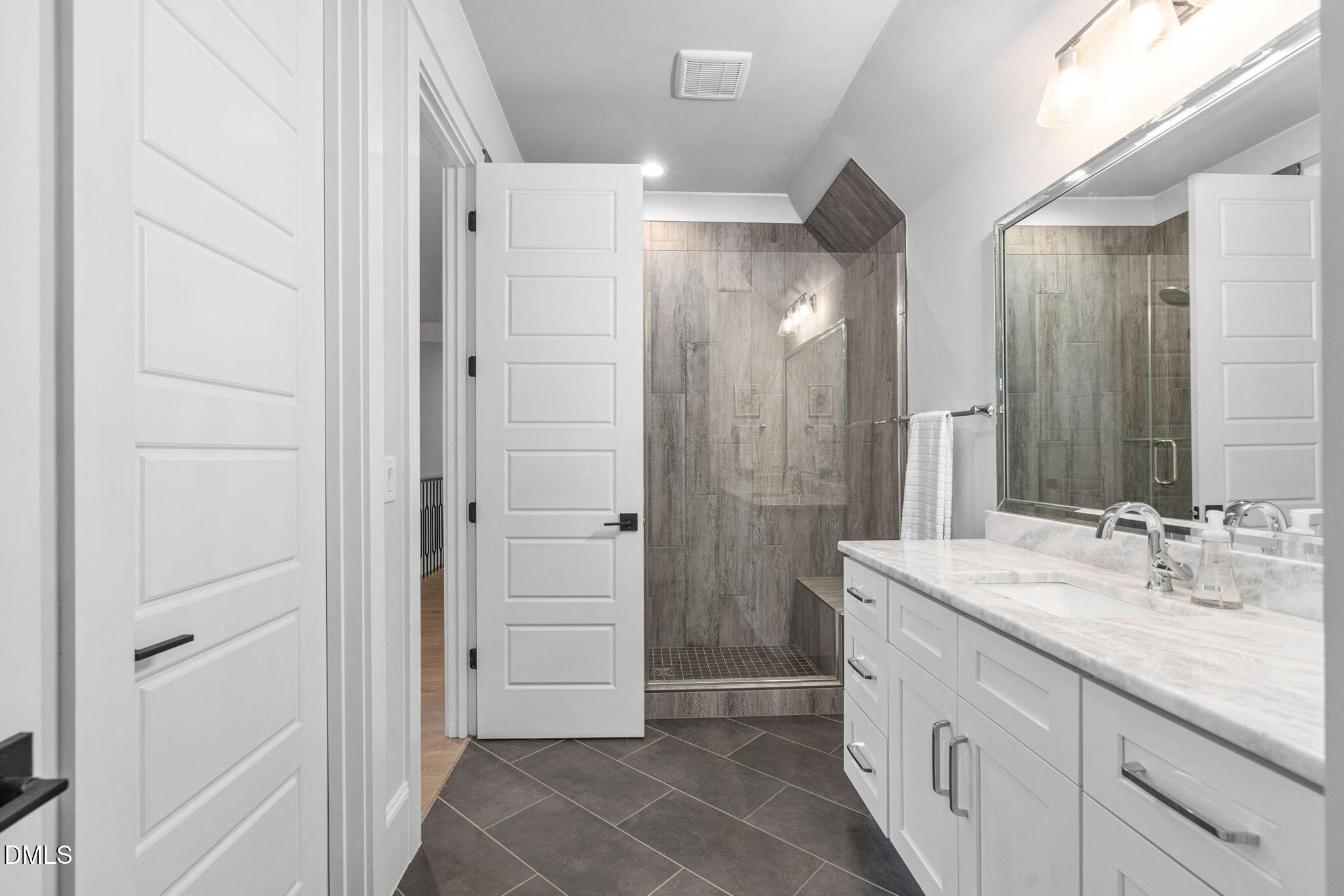 3417 Edgemont Drive Raleigh, NC 27612 - Photo 38 of 70 a bathroom with a sink and a mirror