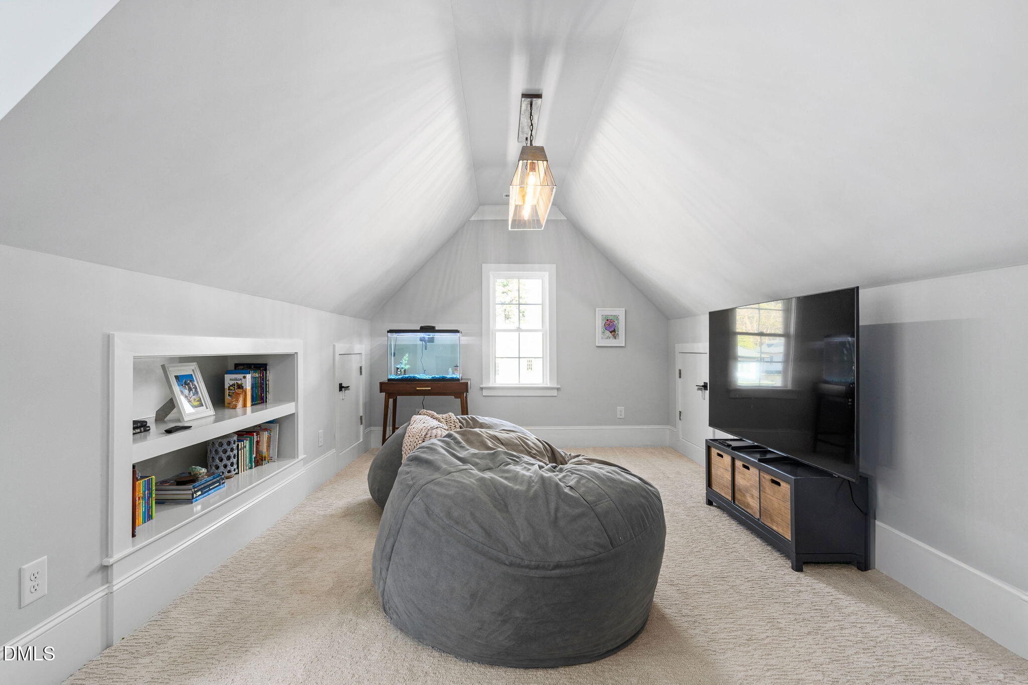 3417 Edgemont Drive Raleigh, NC 27612 - Photo 46 of 70 a living room with furniture and a flat screen tv