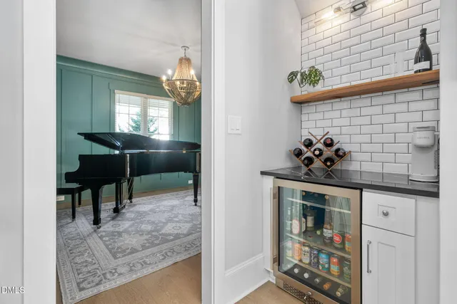 a living room with furniture and a ceiling fan