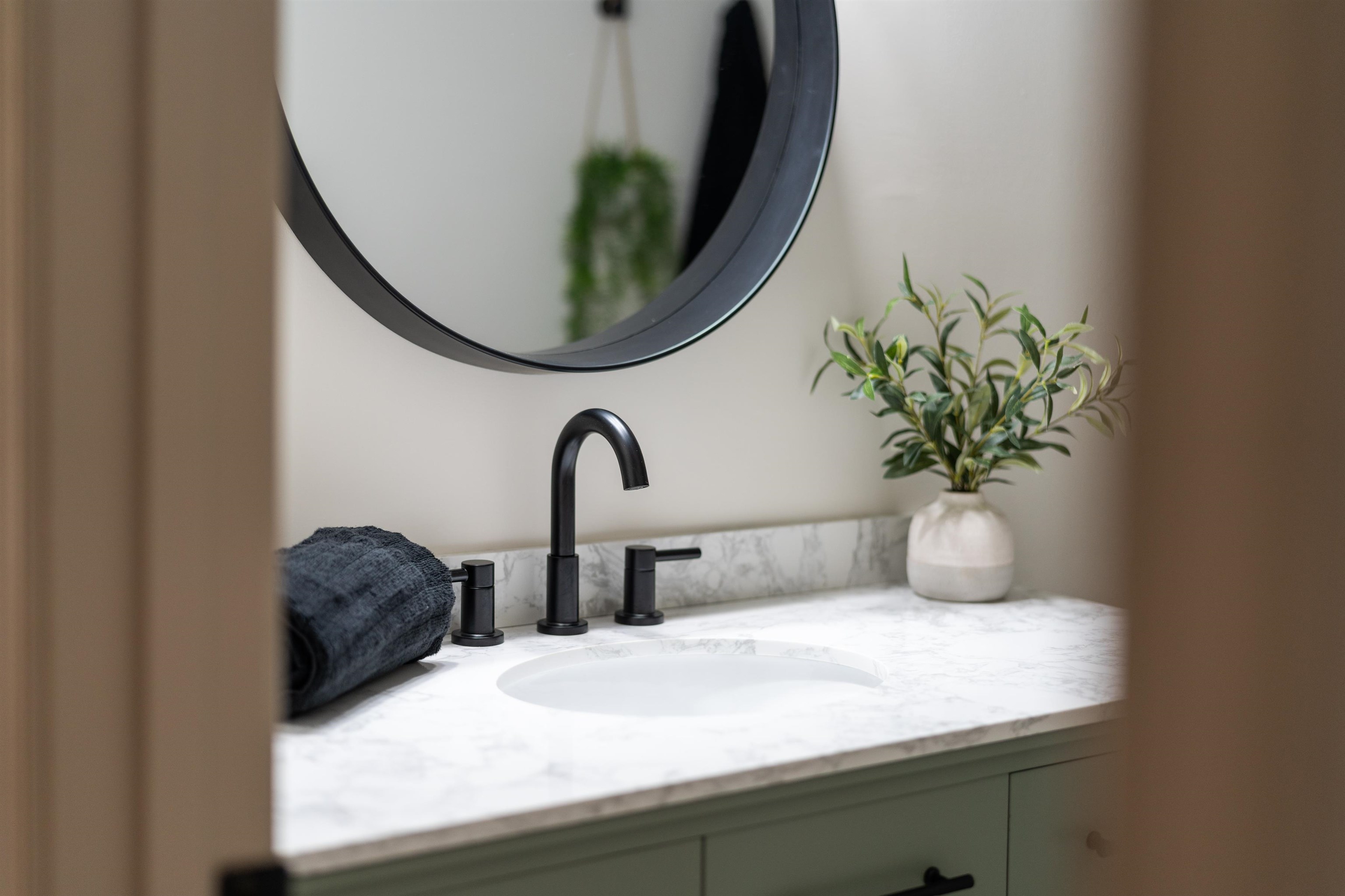 1624 Packard Street Staunton, VA 24401 - Photo 25 of 28 a bathroom with a sink a mirror and a potted plant