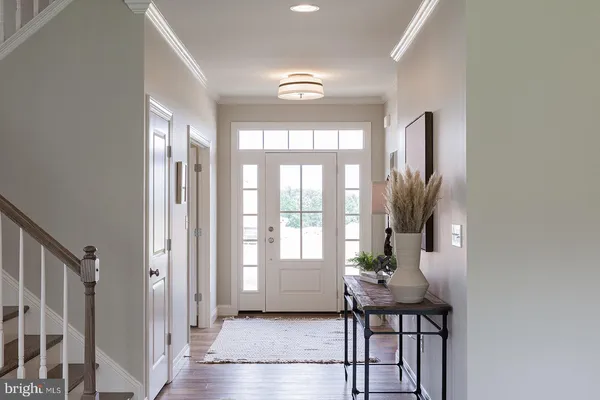 a porch with a table and chairs in it