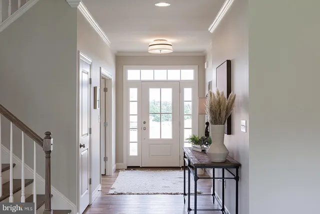 a porch with a table and chairs in it