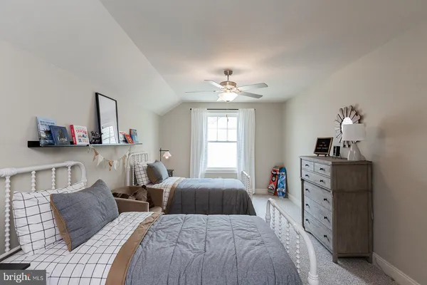 a bedroom with bed and window