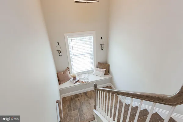 a view of a room with furniture and a window