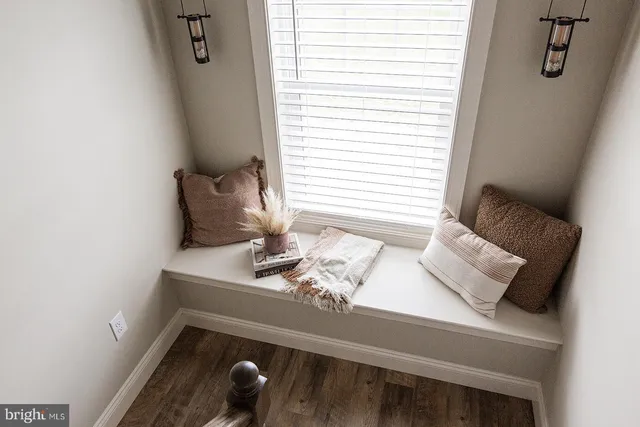 a view of table that has couch on the wall