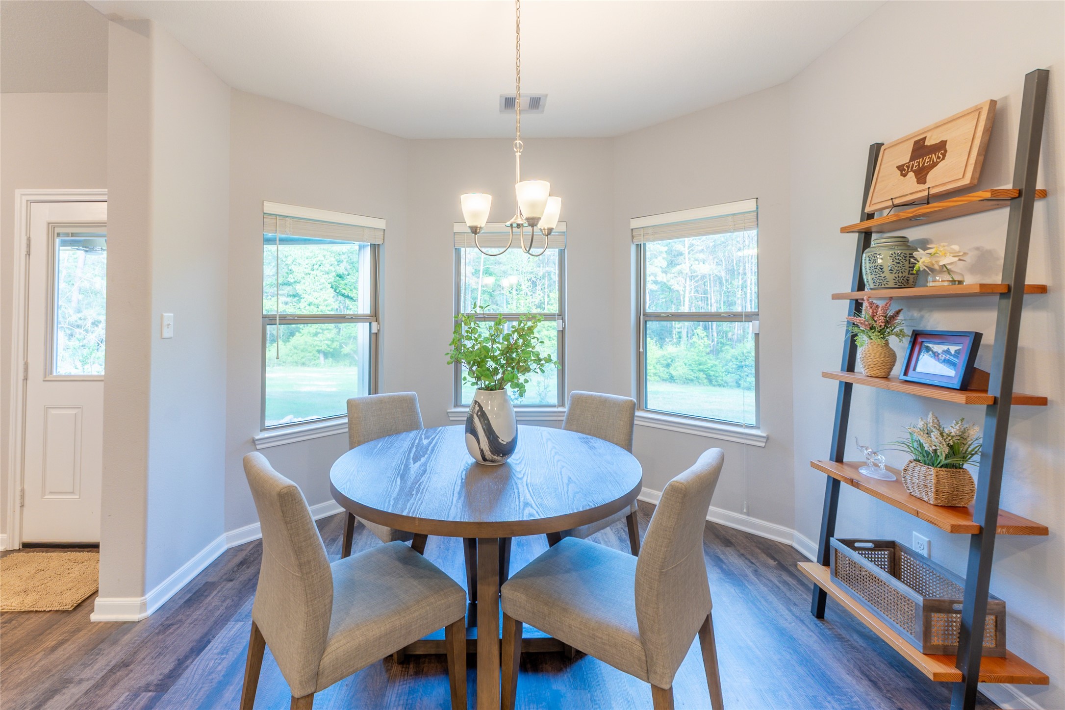120 Sanctuary Road Huntsville, TX 77340 - Photo 11 of 38 a view of a dining room with furniture window and wooden floor