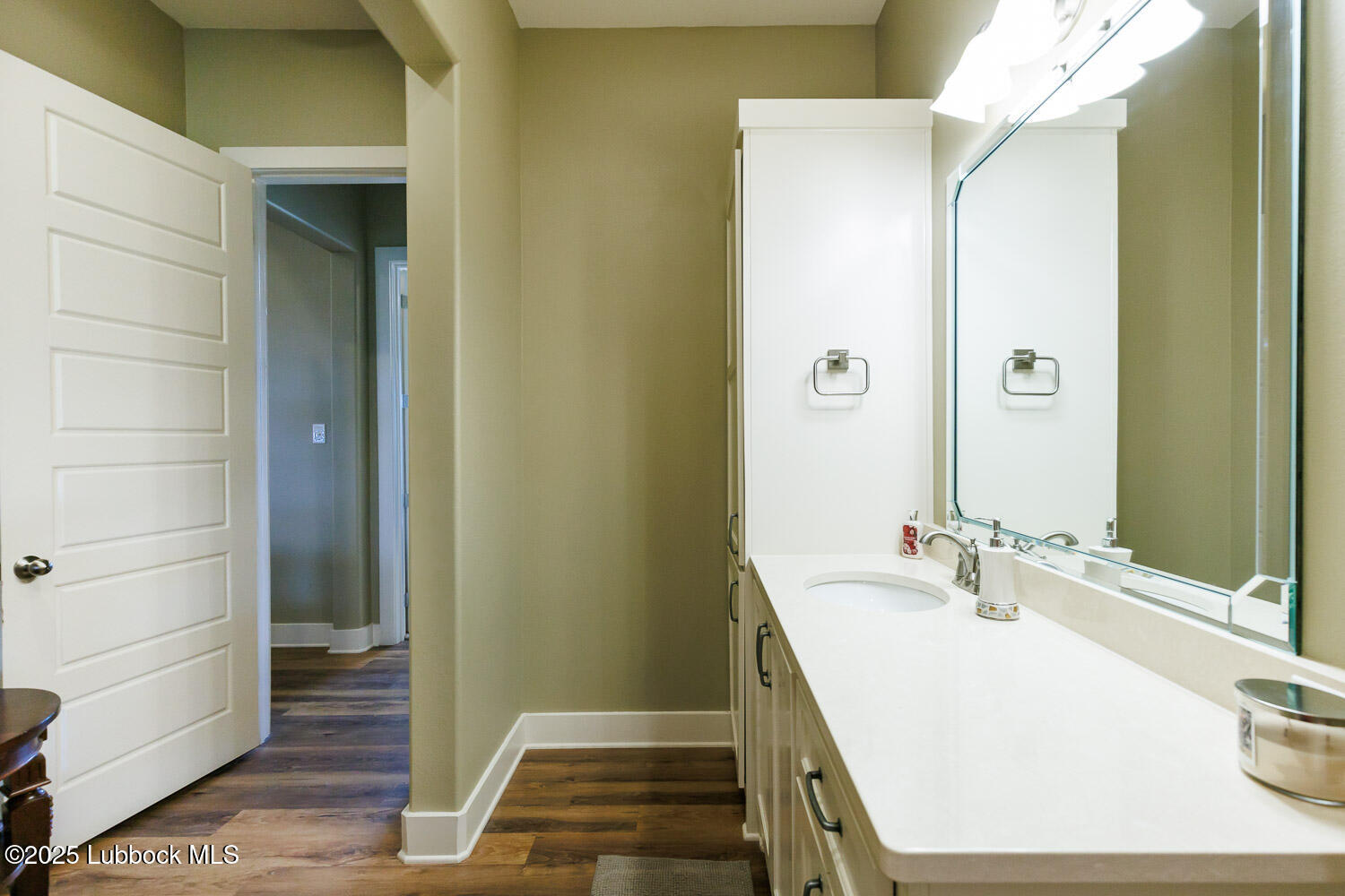 6611 Tiger Ropesville, TX 79358 - Photo 72 of 102 a bathroom with a sink and a mirror