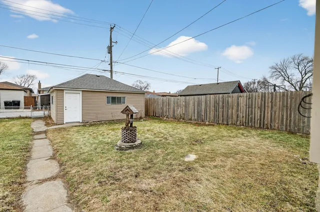 a house view with swimming pool in front of it