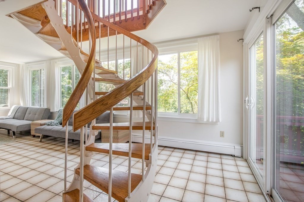 23 Cliff Road Gloucester, MA 01930 - Photo 24 of 37 a view of an entryway with wooden floor and door