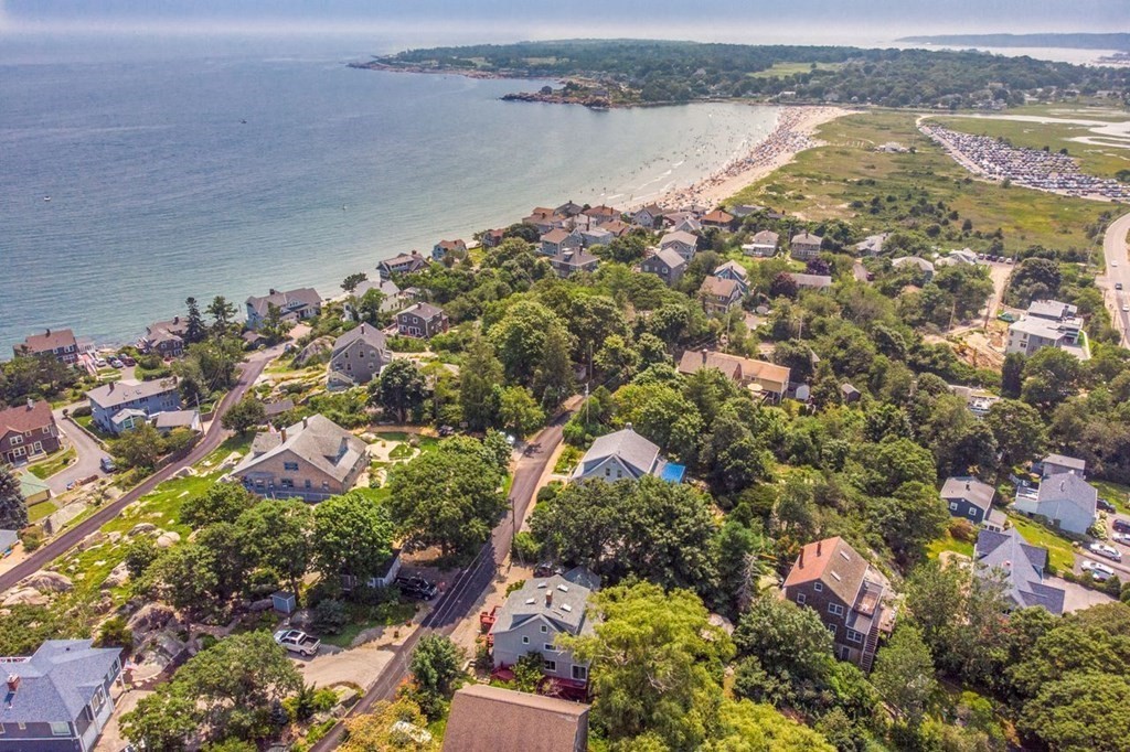 23 Cliff Road Gloucester, MA 01930 - Photo 3 of 37 an aerial view of lake and residential houses with outdoor space