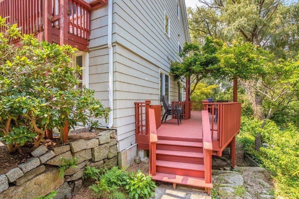 23 Cliff Road Gloucester, MA 01930 - Photo 31 of 37 a view of a backyard with chairs and potted plants