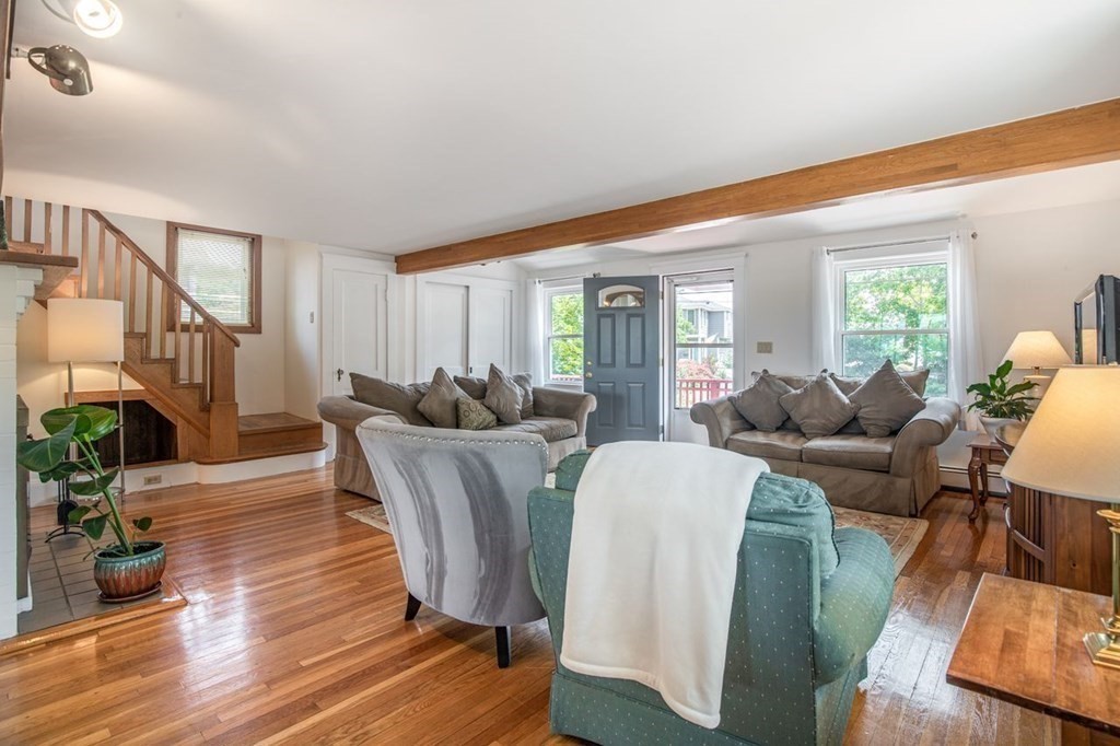 23 Cliff Road Gloucester, MA 01930 - Photo 5 of 37 a living room with furniture a fireplace and wooden floor