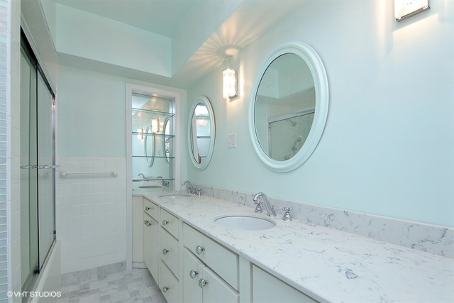 192 Park Avenue Glencoe, IL 60022 - Photo 11 of 24 a bathroom with a granite countertop double vanity mirror and sink