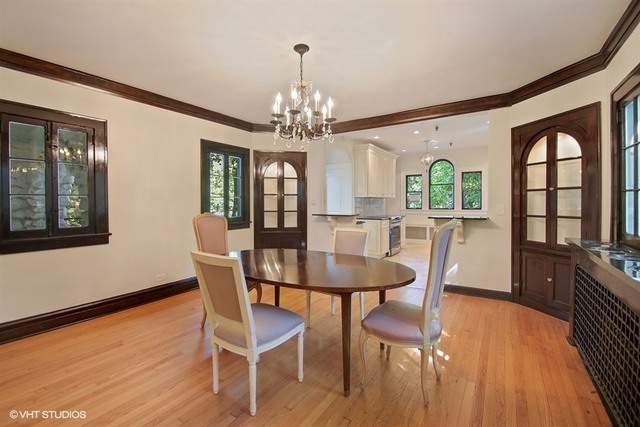 192 Park Avenue Glencoe, IL 60022 - Photo 7 of 24 a view of a dining room with furniture a chandelier and wooden floor