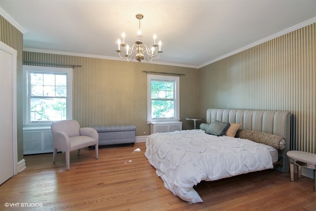 192 Park Avenue Glencoe, IL 60022 - Photo 10 of 24 a bedroom with a bed wooden floor and windows