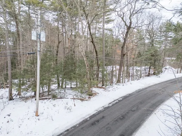 a view of a yard covered in snow