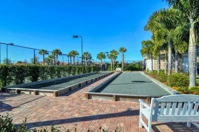 a view of a swimming pool with an outdoor space and seating area