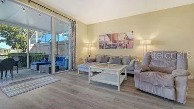 a view of a livingroom with furniture and a flat screen tv