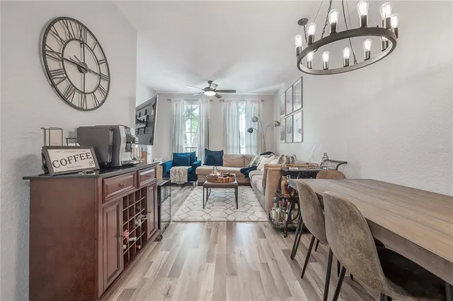 a very nice looking dining room with a table and chairs