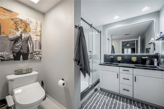 a room with a walk in closet and a mirror