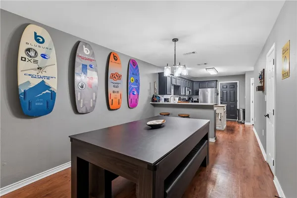 a view of kitchen island with furniture and wooden floor